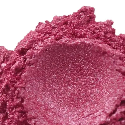 Mound of deep wine rose mica powder with shimmer