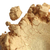 Close-up view of finely ground natural powder, Nurture Handmade skincare product.