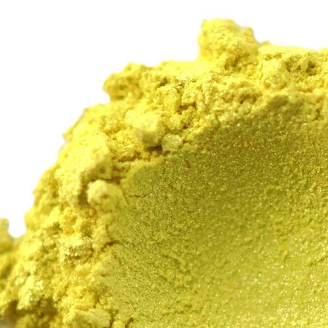 Close-up of yellow powdered ingredient used for Nurture Handmade products