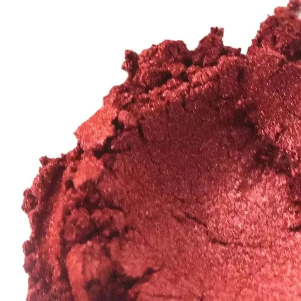 Vibrant ruby red mica powder with fine crimson texture and subtle shimmer