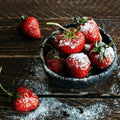 Rustic black bowl of sugared strawberries in Sugared Strawberry Fragrance Blend
