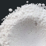 Fine white powder close-up texture showcasing purity and quality for nurture handmade products.