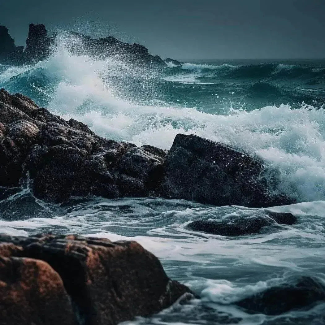 Dark rugged rocks jut from churning ocean waves in Turn the Tide FO/EO Blend