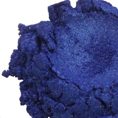 Mound of deep navy blue mica powder with fine shimmer