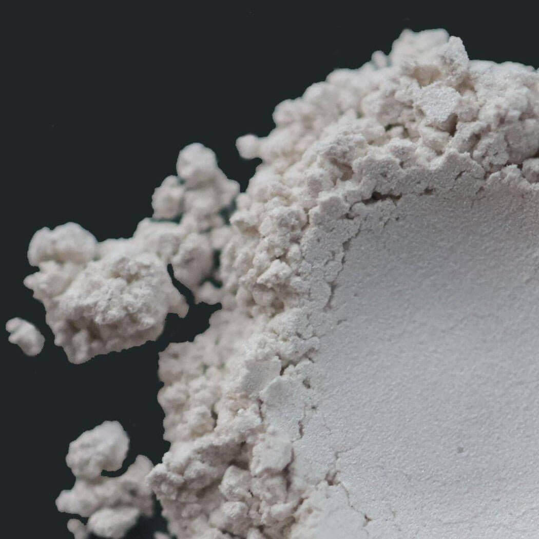 Nurture Handmade white powder close-up, showcasing fine texture ideal for crafting and handmade projects.