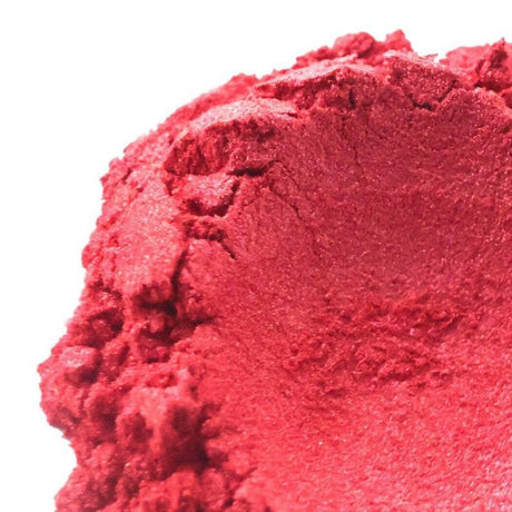 Close-up of a vibrant red handmade powder pigment, representing creativity and natural crafting materials from Nurture Handmade.