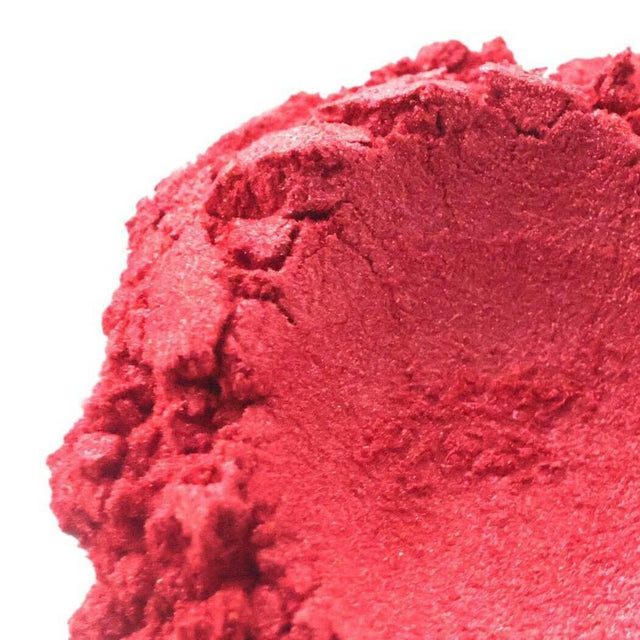 Close-up of a vibrant red handmade powder pigment, representing creativity and natural crafting materials from Nurture Handmade.