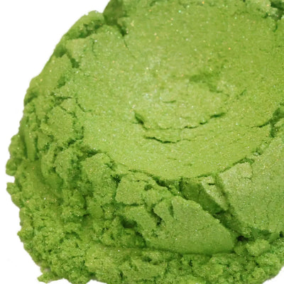Mound of shimmering lime green mica powder on white