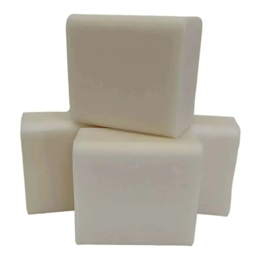 Pyramid stack of four off-white rectangular Low Sweat White Soap Base bars