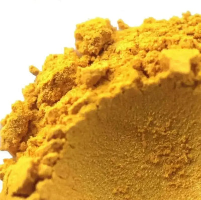 Mound of golden yellow mica powder, crumbly at the edges